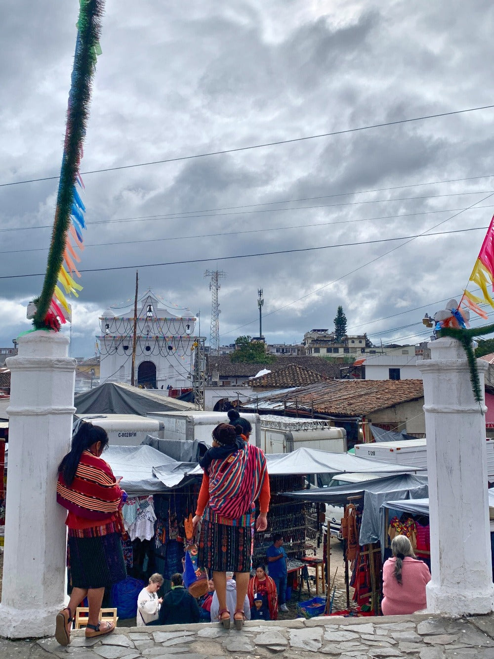 A woman carries her baby on her back in Chichicastenango