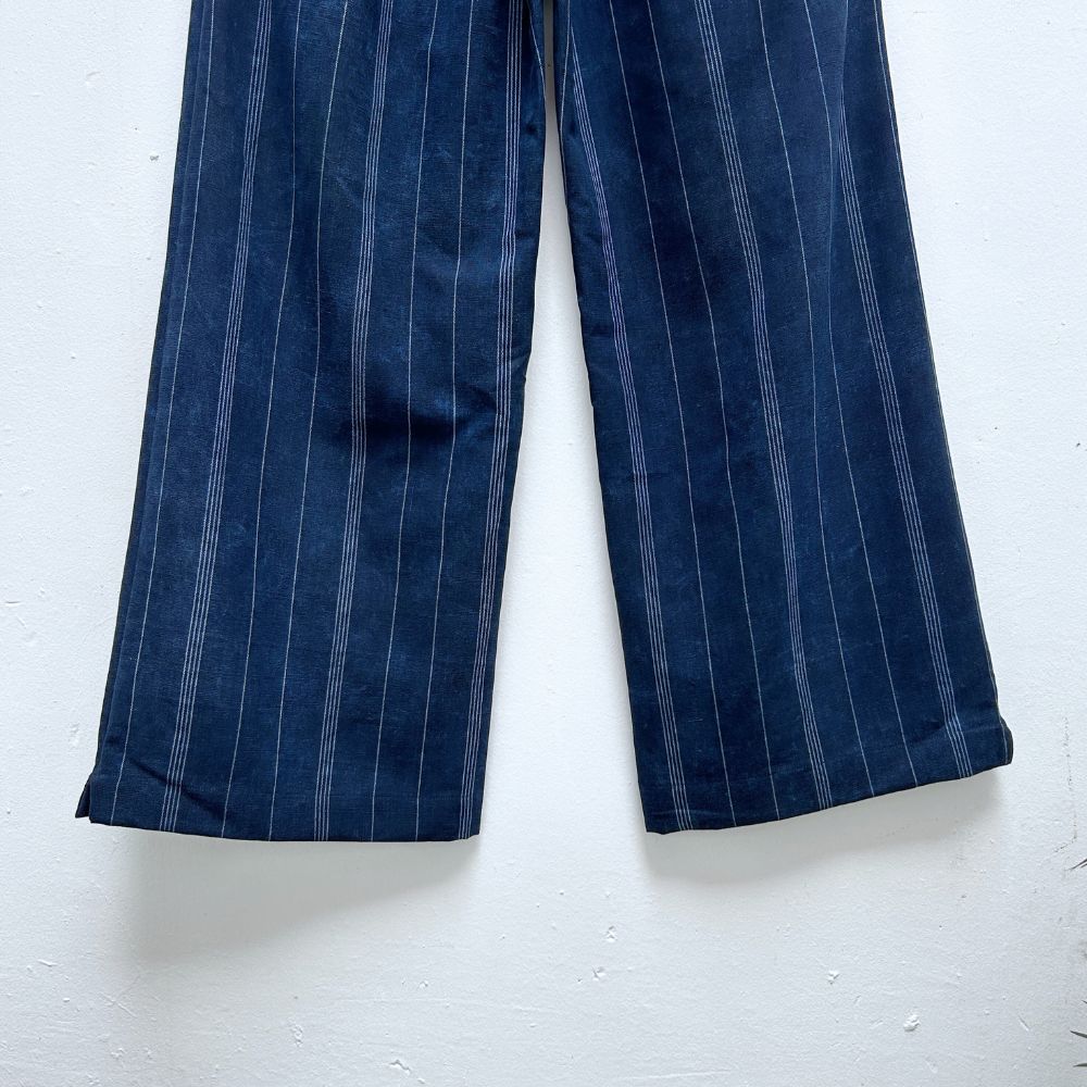 Blue pinstripe pants on a white background