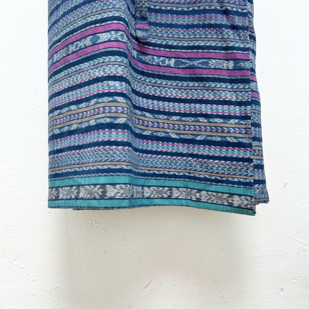 Fabric with blue and purple pattern on a white background