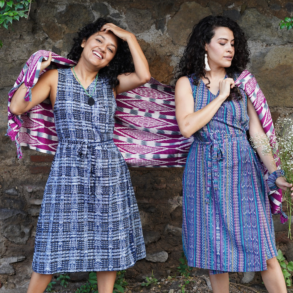 Two model with a blue and white dress and stripe dress colorful ikat fabric