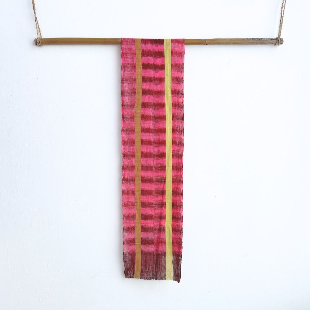 Striped fabric with pink and yellow pattern on a white background