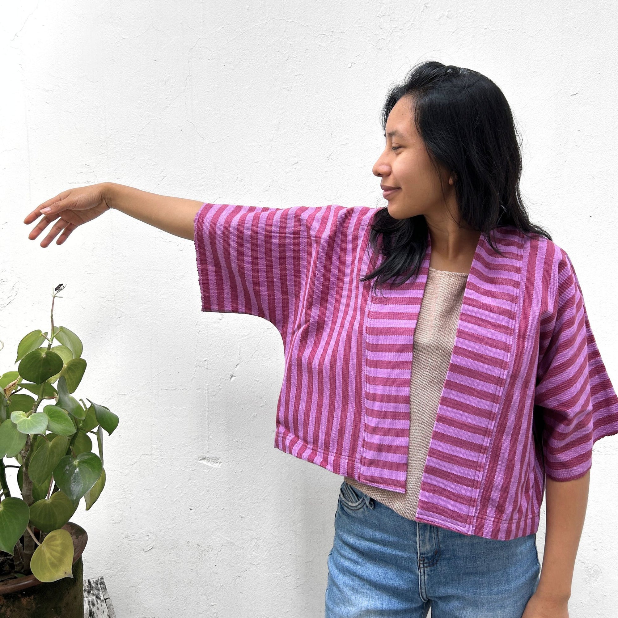 Woman wearing Two Shades of pink striped cropped jacket