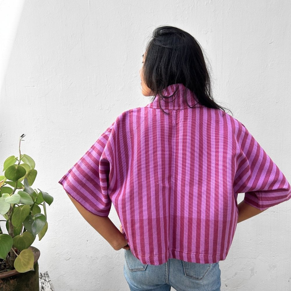 Person wearing Two Shades of pink striped cropped jacket