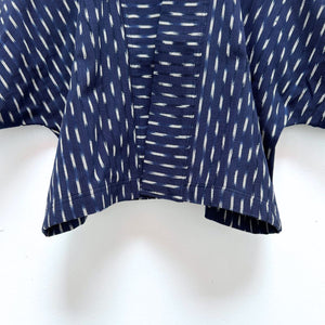 Indigo blue jacket with white  ikat pattern hanging 