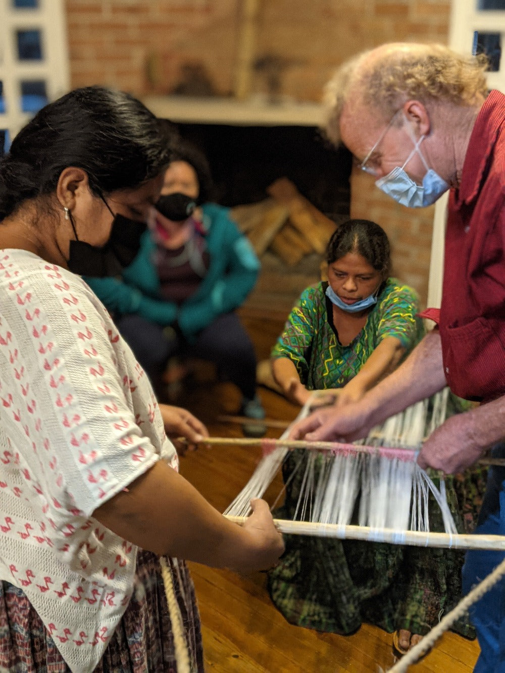 Master weavers demonstrate how to set up a loom for pikbil 
