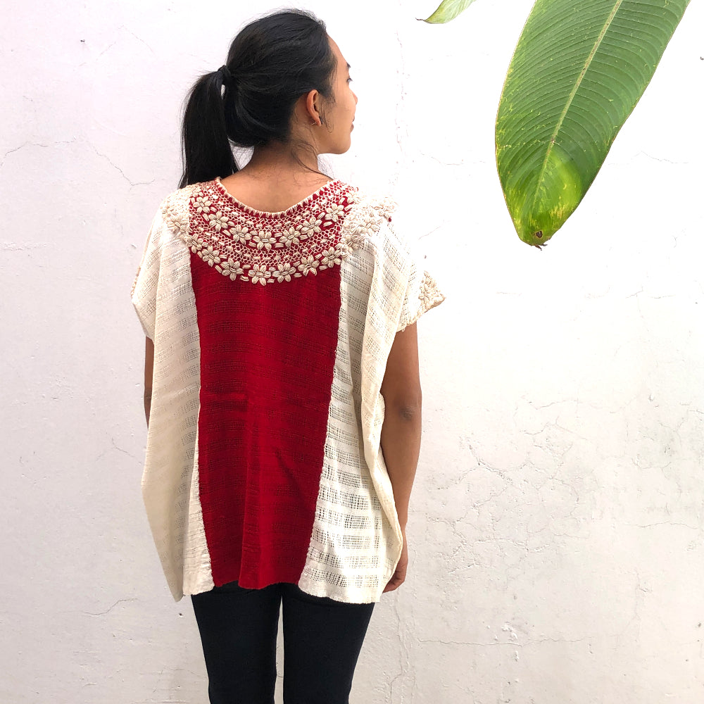 Model wearing beige and red base woven blouse with embroidery french knot neckline reference picture