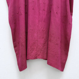Magenta base woven blouse two panels brocade figures.