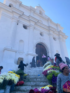 A view from the bottom of the steps to La Iglesia Santo Tomás in Chichicastenango, Guatemala