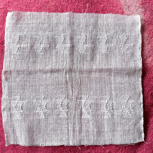 Textile with brocade figures and characters 