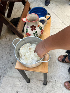 Person preparing tortilla starch in a pot 