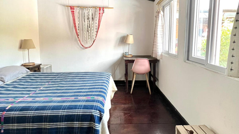 The Garden Guest Room comes with a full size bed, a desk and chair, lamps, and closet.