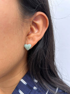 Close-up of an ear wearing Heart-Shaped Light green jade Stud Earrings