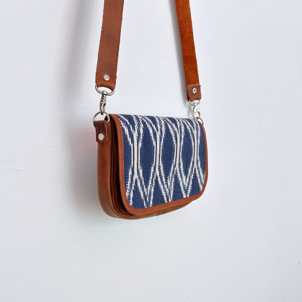Small handbag with blue and white pattern diamonds and brown leather strap