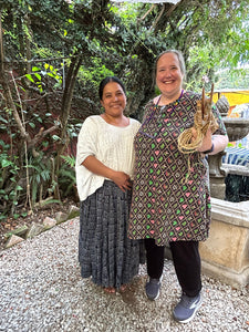 Teacher and student smiling together at the end of the week