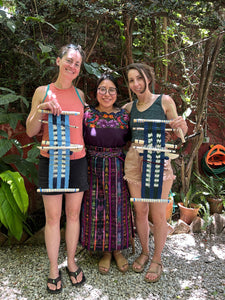 The teacher with her two students after the weaving class.
