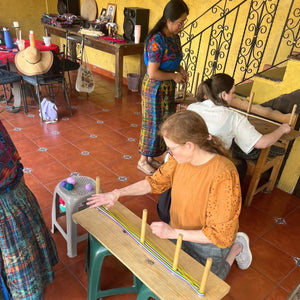 At the weavers’ home, the students are creating their own loom, choosing the colors and threads for their weaving project