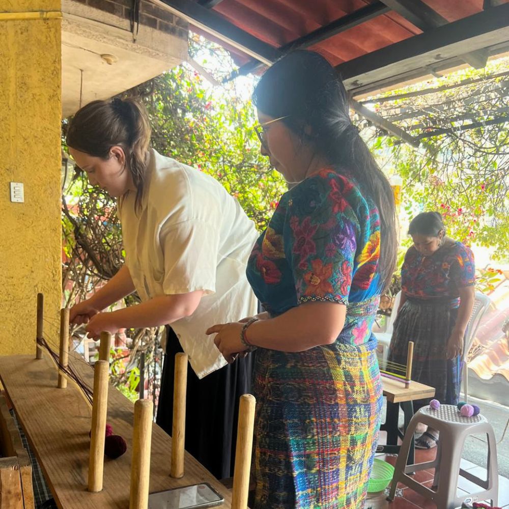 Student and teacher during the loom creation process.