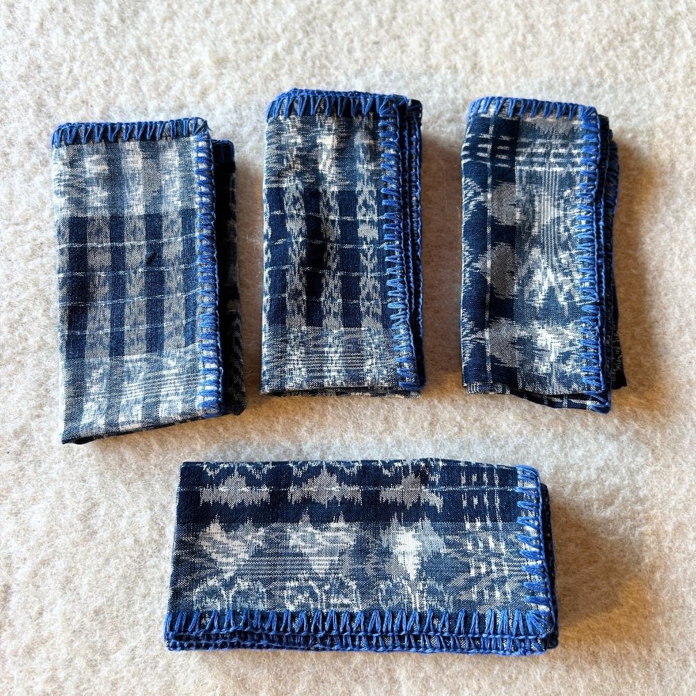 Hand-embroidered Corte Napkins: Light Indigo on blue (set of 4)