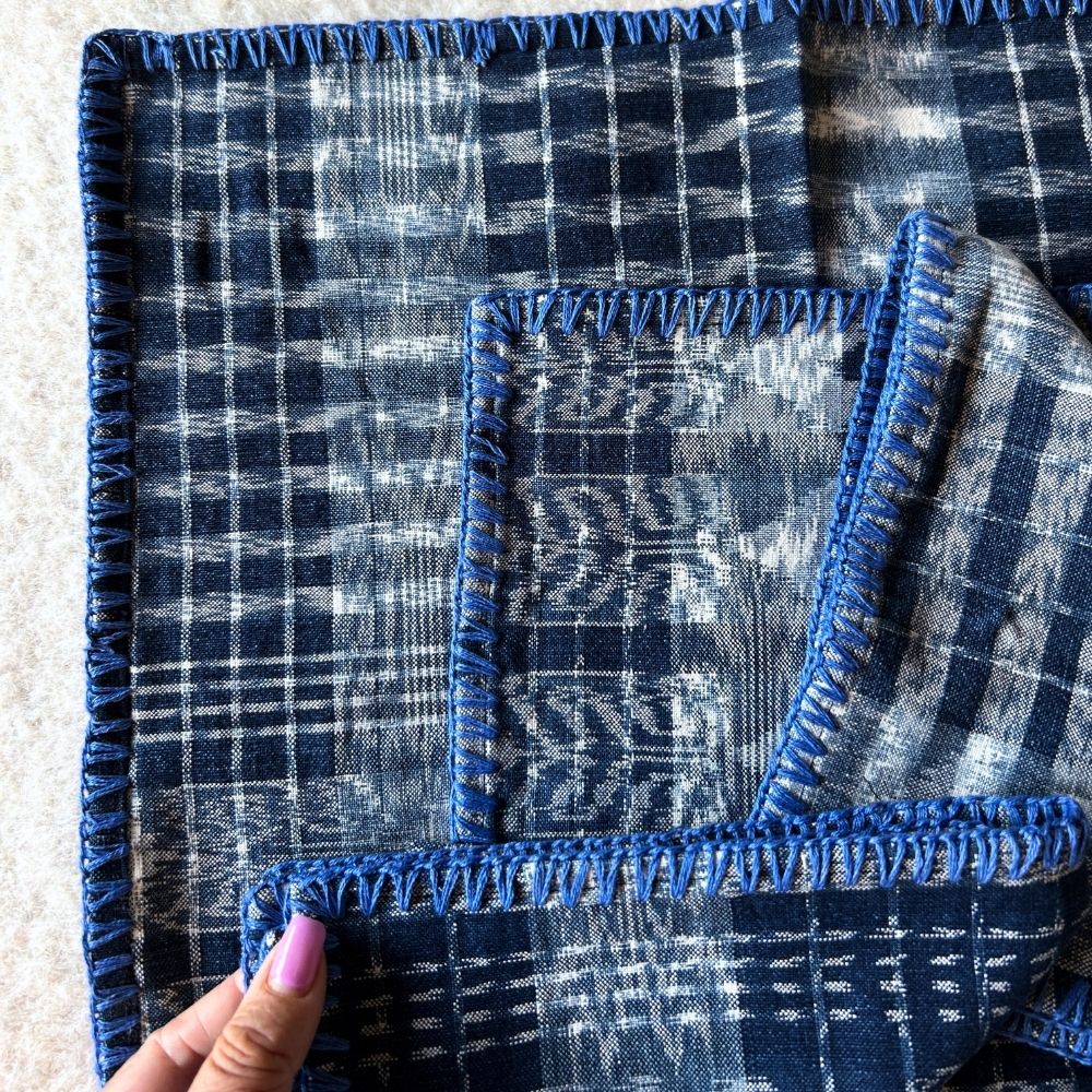 Hand-embroidered Corte Napkins: Light Indigo on blue (set of 4)