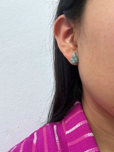 Close-up of an ear wearing a Pear-Shaped Medium Green Jade Stud Earrings