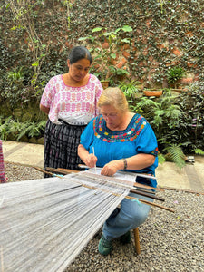 A master weaver and student weaving using the traditional Pikbil technique from Cobán.