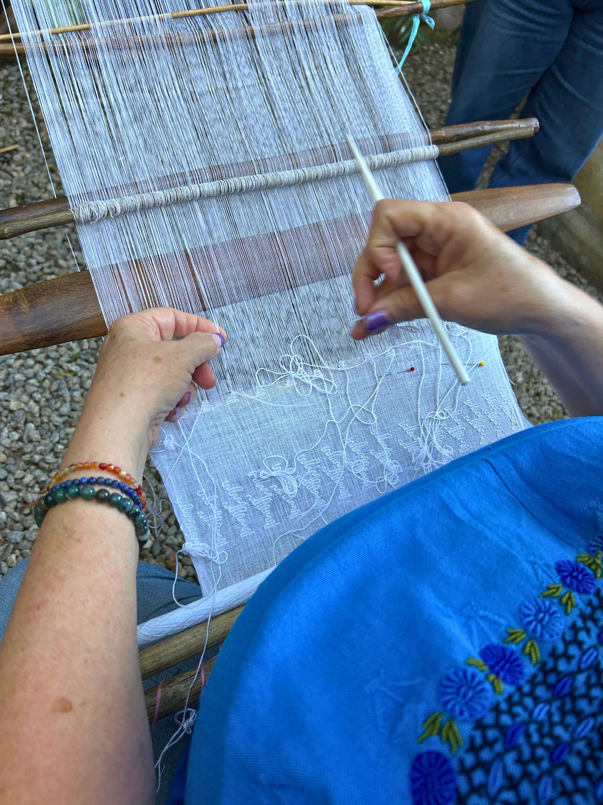 Detailed view of the iconic duck motifs woven into a traditional Pikbil textile.