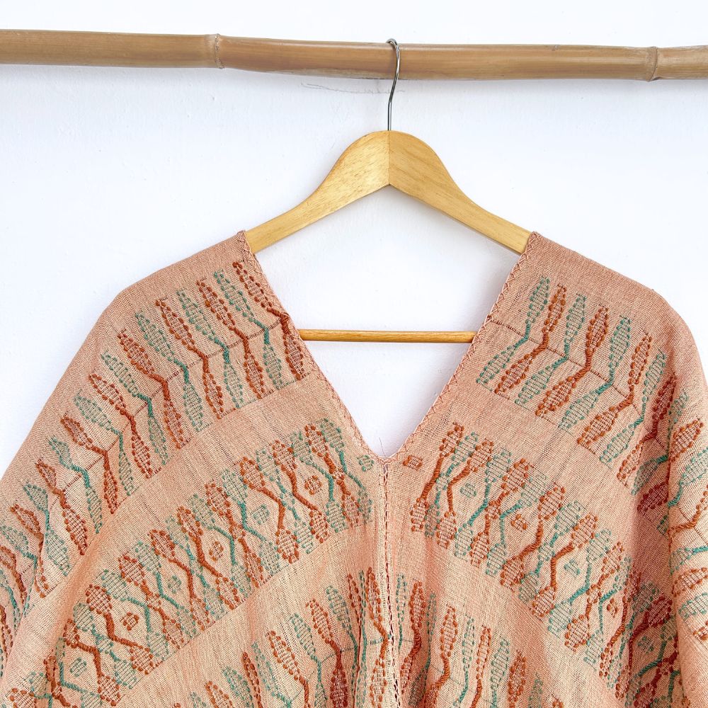 Two-panel blouse in beige coconut color with handspun threads, brocade figures of leaves.