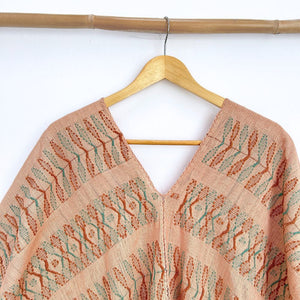 Two-panel blouse in beige coconut color with handspun threads, brocade figures of leaves.