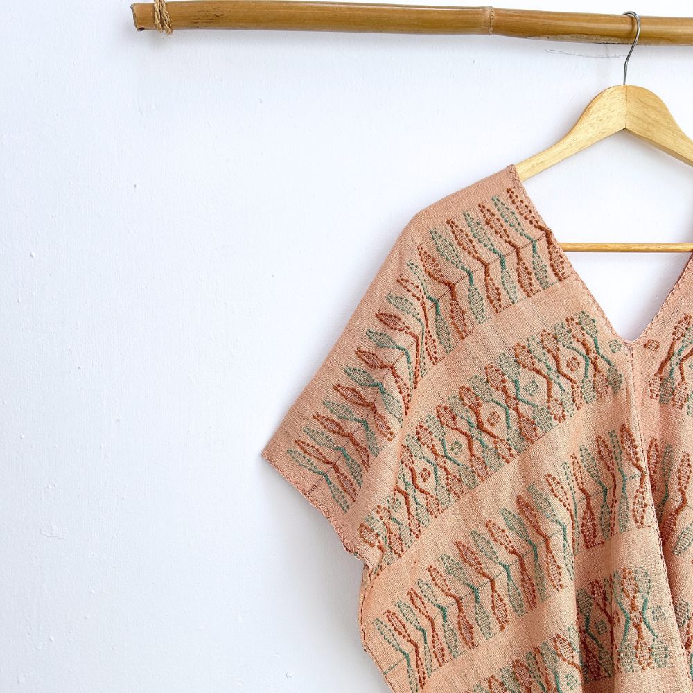 Two-panel blouse in beige coconut color with handspun threads, brocade figures of leaves.