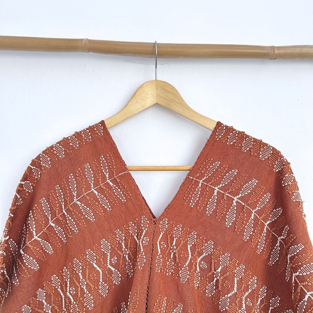 Two-panel blouse in soft brown with handspun threads, brocade figures of leaves.
