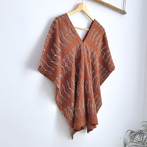 Two-panel blouse in soft brown with handspun threads, brocade figures of leaves.