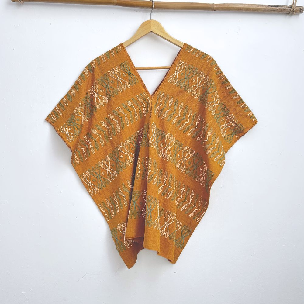 Two-panel blouse in mustard yellow with handspun threads, brocade figures of leaves.