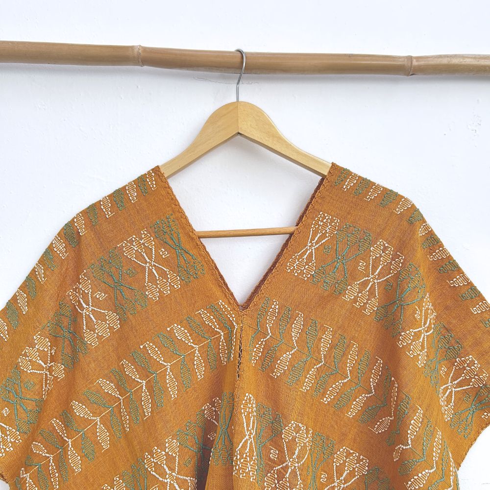 Two-panel blouse in mustard yellow with handspun threads, brocade figures of leaves.