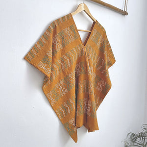 Two-panel blouse in mustard yellow with handspun threads, brocade figures of leaves.