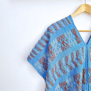 Two-panel blouse in sky blue color with handspun threads, brocade figures of leaves.