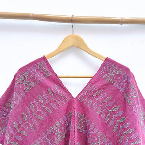 Two-panel blouse in soft magenta color with handspun threads, brocade figures of leaves.