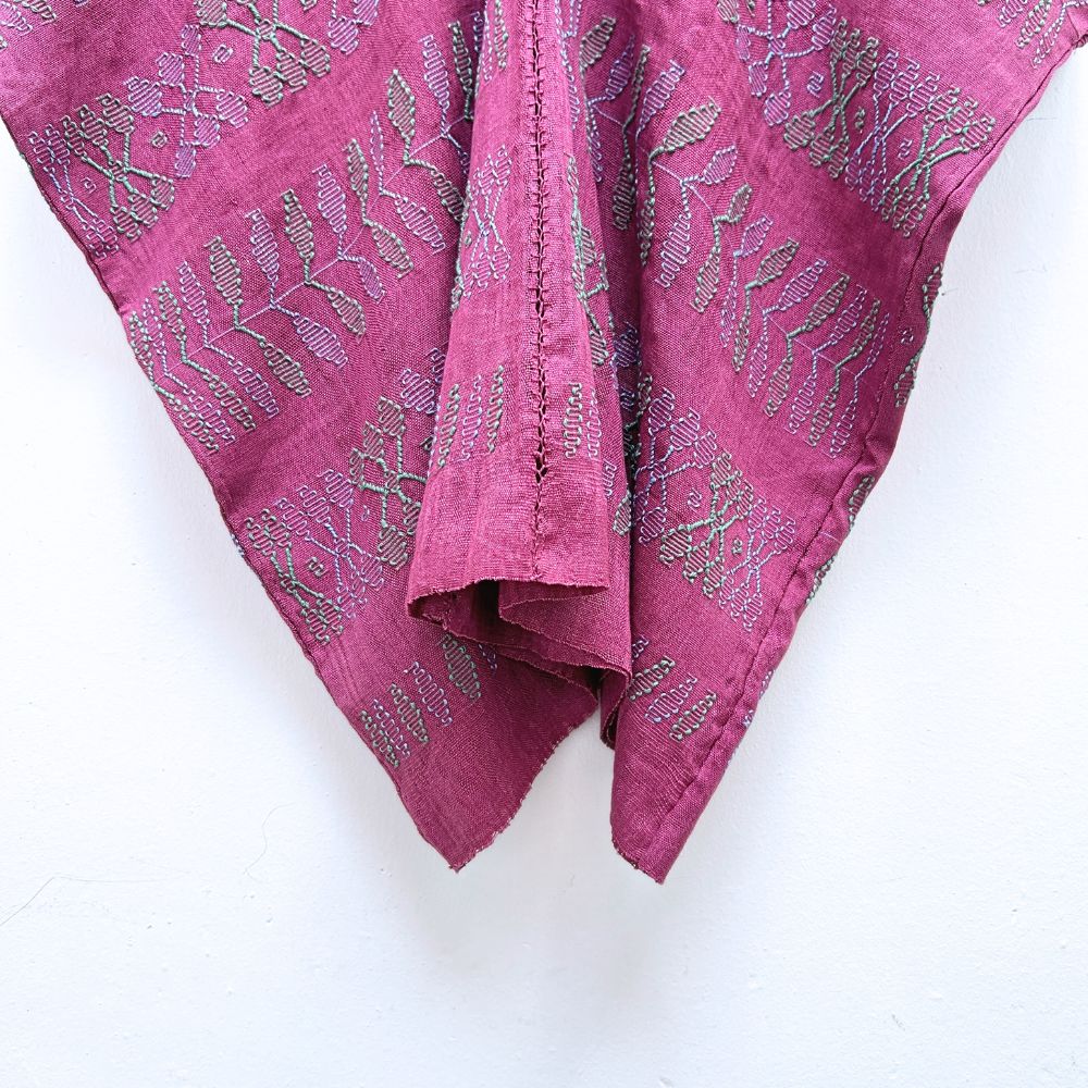 Two-panel blouse in soft magenta color with handspun threads, brocade figures of leaves.