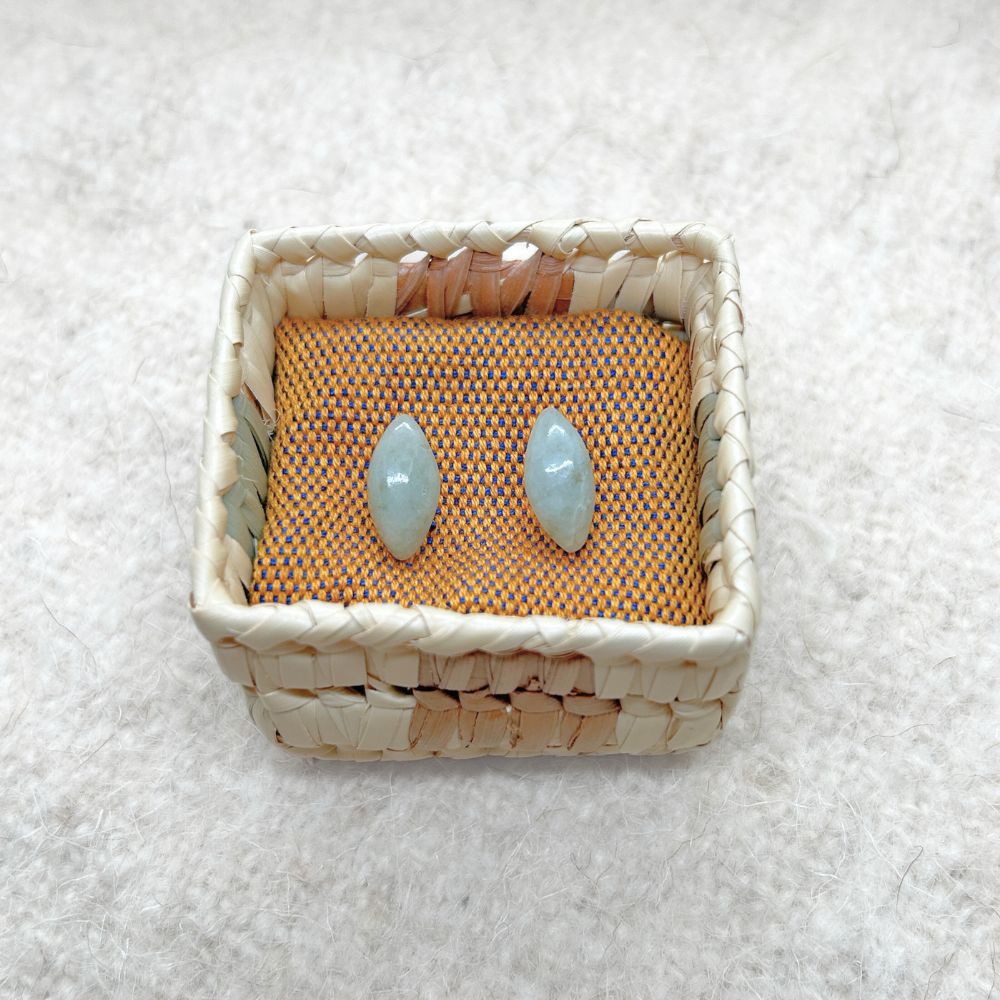 Pair Pointed Oval-Shaped Light Green Jade Stud Earrings in a woven palm basket 