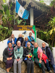 Group of people happily posing for a picture after magnificent quetzal sightings