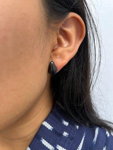 Close-up of an ear wearing a Rhombus-Shaped Black Jade Stud Earrings