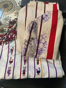 Traditional Guatemalan embroidered textiles featuring bird motifs and geometric patterns.