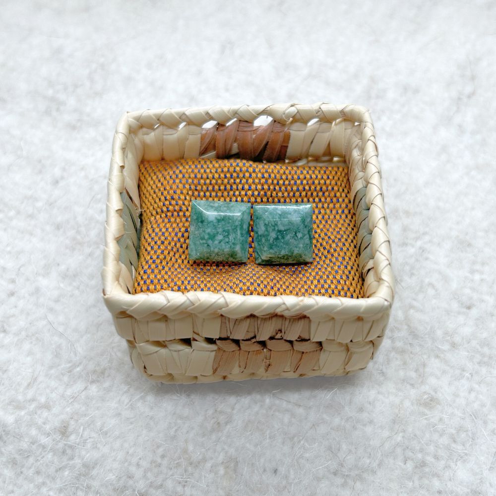 Square-Shaped Medium Green Jade Stud Earrings in a woven basket on a textured white background