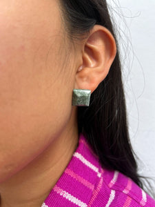 Close-up of an ear wearing Square-Shaped Medium Green Jade Stud Earrings
