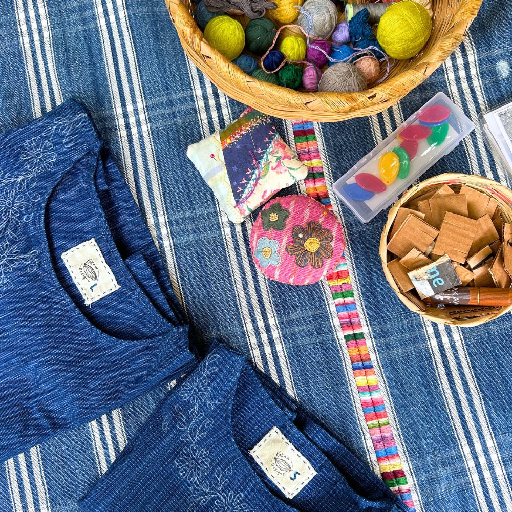 Two tops, one size L and one size S, along with many colorful threads to choose from for embroidering the flowers.