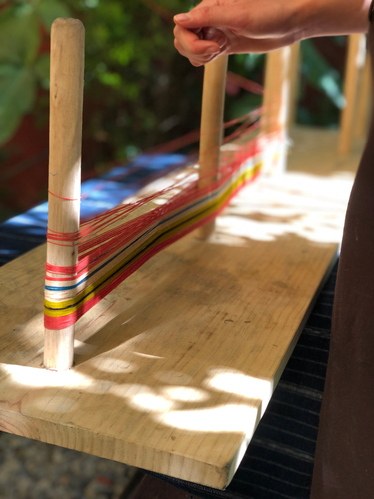 Close-up of threads on a warping board