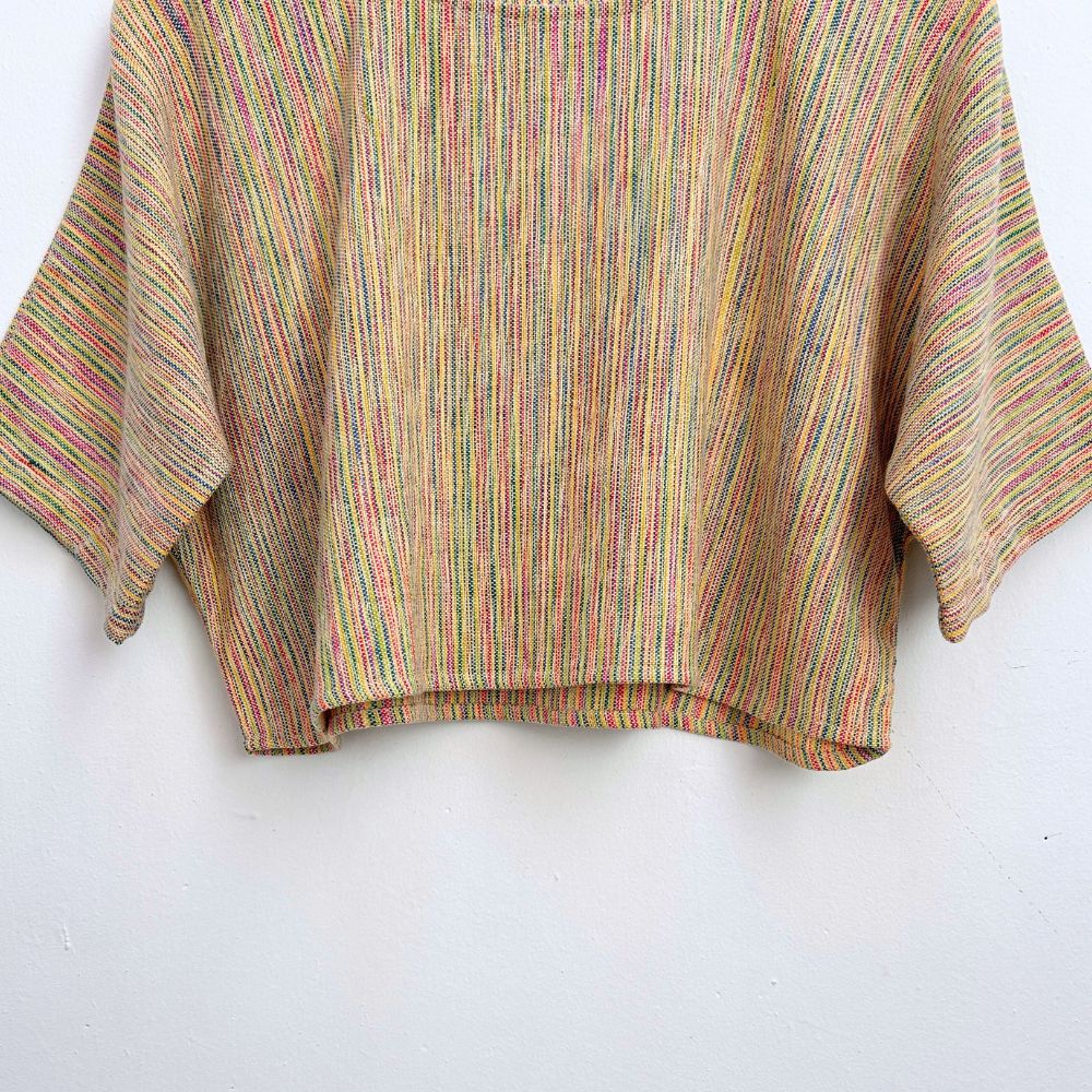 Multicolored striped top on a white background