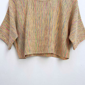 Multicolored striped top on a white background