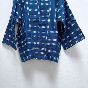 Blue patterned kimono on a white background